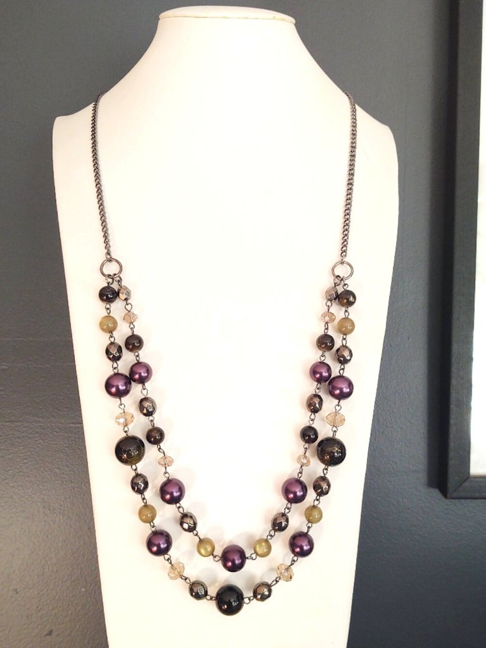 Metallic purple and green beaded necklace with dark gray accent beads